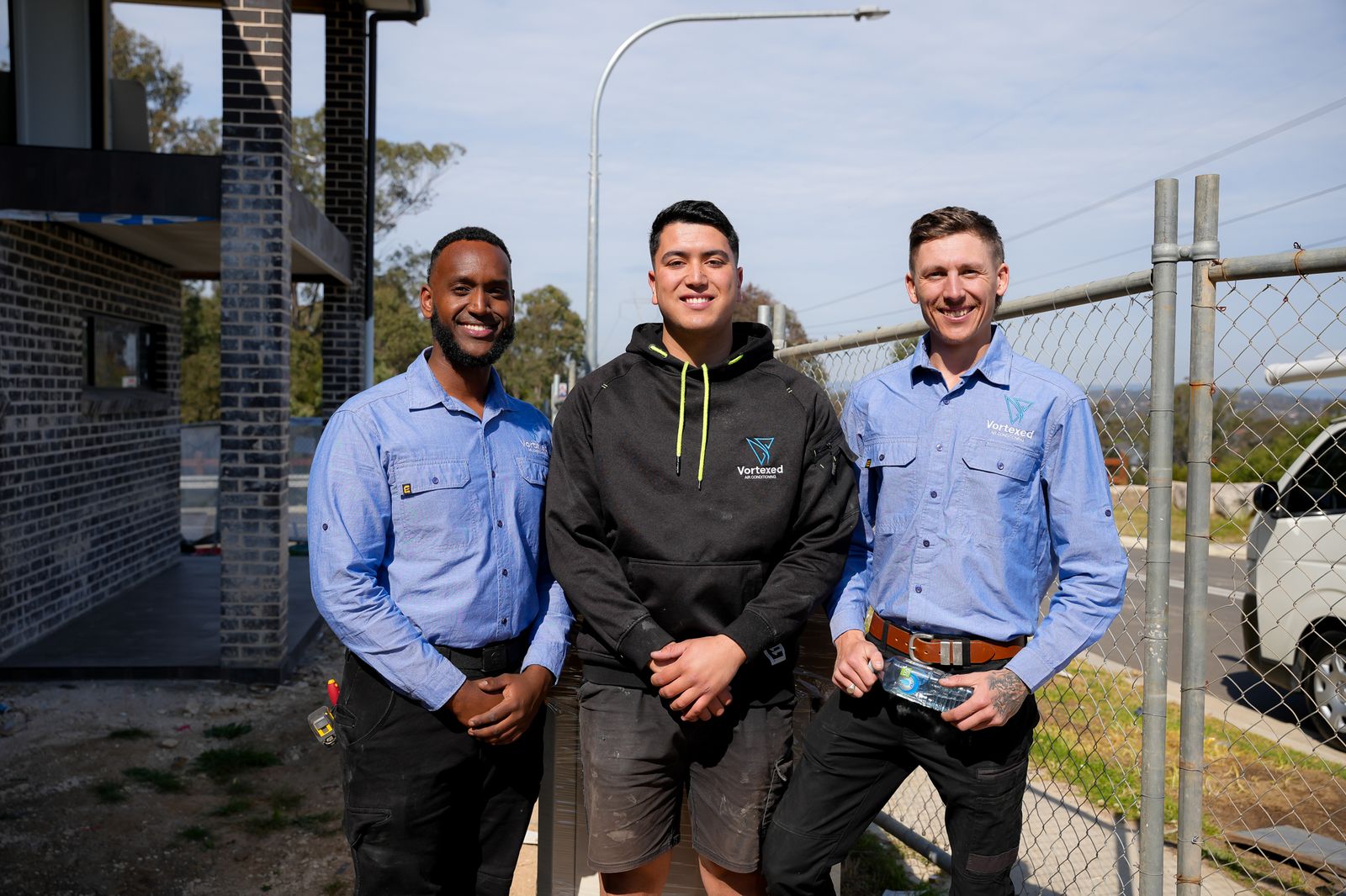 Air conditioning technicians installing commercial HVAC system Sydney